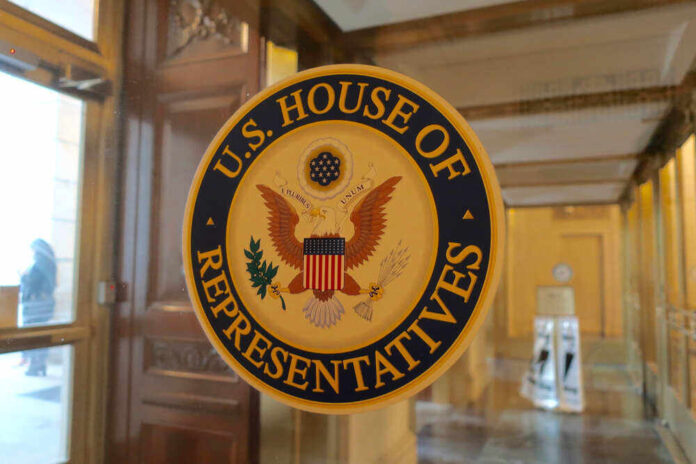 shutterstock_1381876346.jpg featured image U.S. House of Representatives seal on glass door.