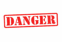 Red danger stamp on white background