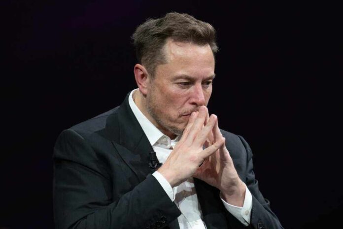 shutterstock_23188003131.jpg featured image Elon Musk in suit thinking.