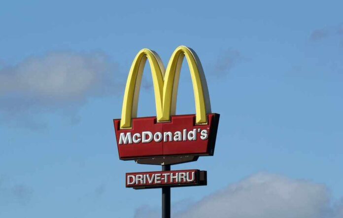 shutterstock_2433110395.jpg featured image McDonald’s drive-thru sign against a blue sky.