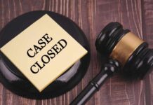 Gavel and case closed note on table