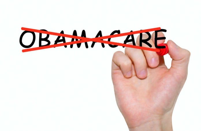 shutterstock_558637486.jpg featured image Hand crossing out the word Obamacare in red