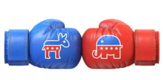 Blue donkey and red elephant boxing gloves facing off.