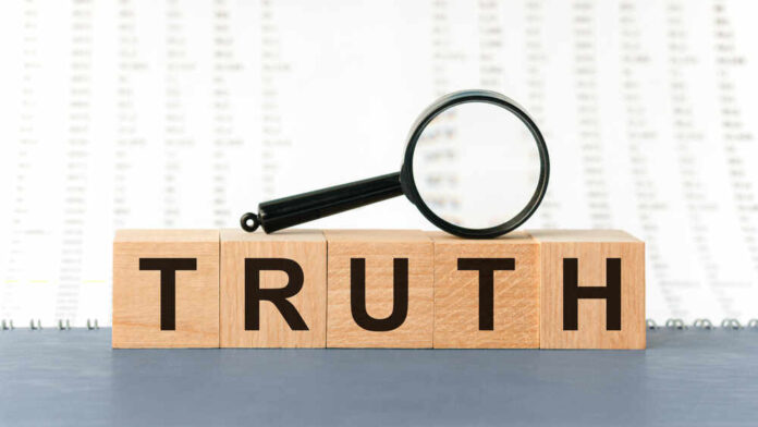 shutterstock_1868580070.jpg featured image Wooden blocks spelling truth with magnifying glass