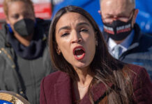Alexandria Ocasio-Cortez speaking at an event.