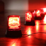 Red emergency lights on a dark floor