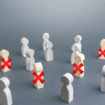 Wooden figures with red X marks, signifying eliminated individuals.
