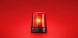 Red emergency light on red background