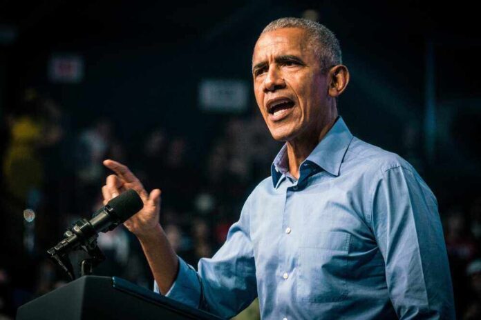 Barack Obama speaks at podium.
