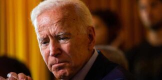 Joe Biden solemn, thinking.