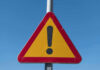 Triangular warning sign with exclamation mark