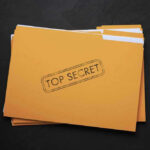 Explosive Trump–Russia Documents Found — Hidden Secrets?! Yellow folder labeled Top Secret on black background