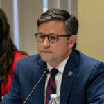 Epstein Shock: Speaker Johnson Defies Trump Mike Johnson in suit speaking.