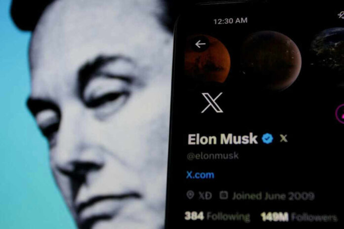 shutterstock_2336798023-1.jpg Elon Musk's profile on mobile screen, blurred background face.