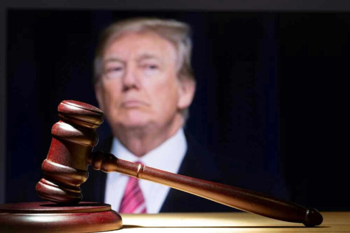 Gavel in foreground with blurry man in background