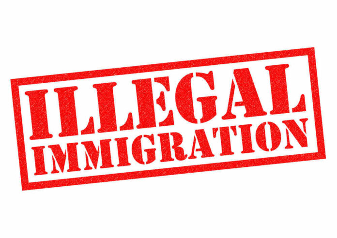 shutterstock_368718257.jpg Red illegal immigration stamp on white background