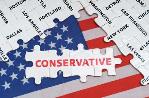 shutterstock_2036268275.jpg Puzzle pieces with the word CONSERVATIVE on an American flag background