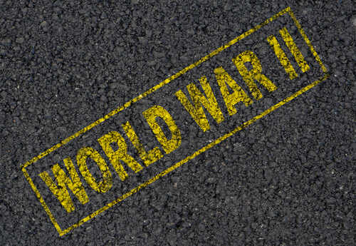 The words 'WORLD WAR II' printed in yellow on a dark asphalt surface