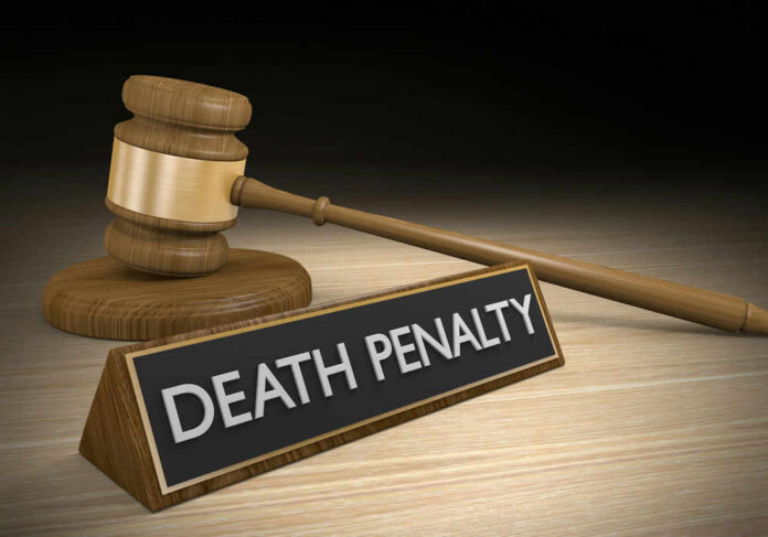 shutterstock_334148753.jpg Gavel beside death penalty sign on desk