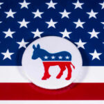 Democrats Launch Controversial Probe Democratic Party donkey on American flag background.
