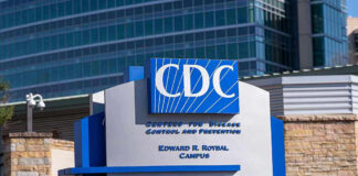 CDC building sign in front of structure.