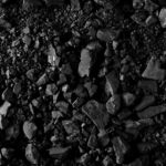 Trump’s Bold Coal Move Sparks Outrage with Leftists Close-up of black coal pieces scattered on a surface