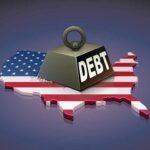 Debt Bomb Ticking: WORSE Than World War II A heavy weight labeled 'DEBT' sits on a map of the United States, symbolizing economic challenges.