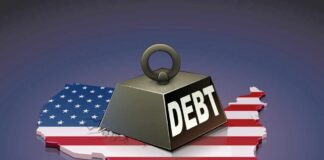 A heavy weight labeled 'DEBT' sits on a map of the United States, symbolizing economic challenges.