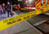 Los Angeles police tape at night crime scene.