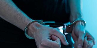 Close-up of hands in handcuffs