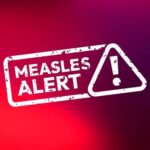 Measles alert warning sign with exclamation mark