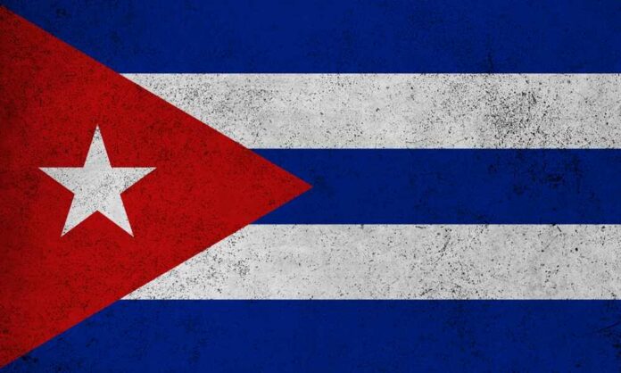 Cuban flag featuring red triangle, white stripes, and a star