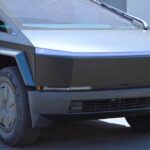 A futuristic electric truck parked in an outdoor lot