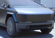 A futuristic electric truck parked in an outdoor lot