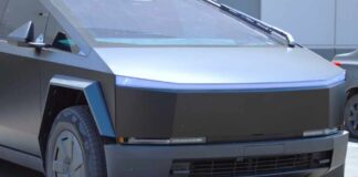 A futuristic electric truck parked in an outdoor lot