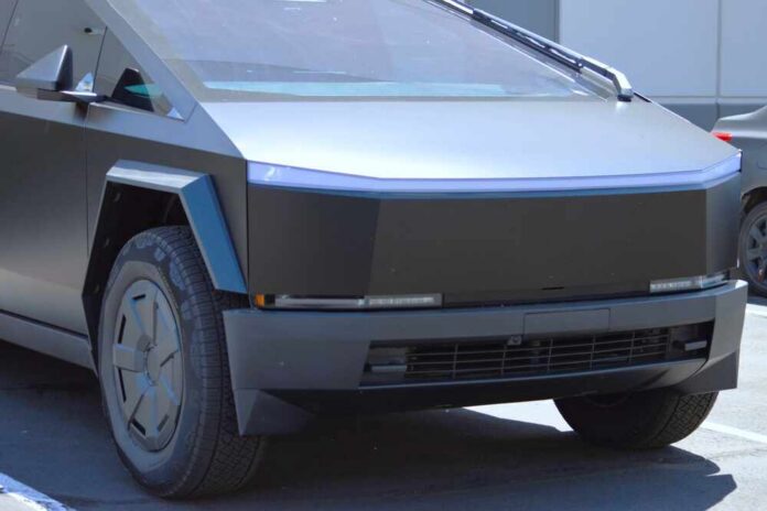 A futuristic electric truck parked in an outdoor lot