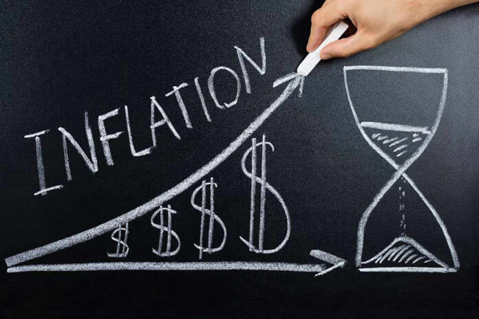 555956236 Chalkboard drawing of inflation with rising dollar symbols.