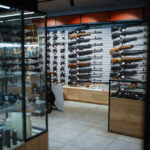 Interior of a gun shop showcasing various firearms on display