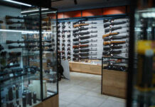 AR-15 BARRAGE Hits Rihanna’s Mansion — Kids Inside Interior of a gun shop showcasing various firearms on display