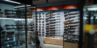 Interior of a gun shop showcasing various firearms on display