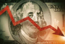 Red downward arrow over Benjamin Franklin on US dollar.