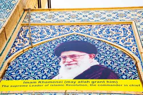 Mural of Ali Khamenei with decorative background and text