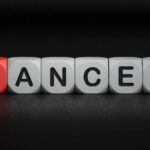 Blocks spelling the word 'CANCER' with one block in red