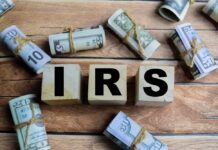 IRS Dirty Dozen Unleashes Tax Terror Wooden blocks spelling IRS surrounded by rolled currency notes