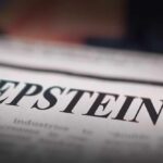 Close-up of a newspaper headline reading 'EPSTEIN'