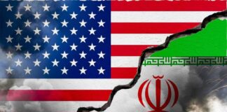 A cracked wall displaying the flags of the USA and Iran, symbolizing conflict