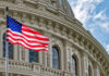Trump’s SAVE America Act Sparks Senate Showdown American flag in front of ornate building facade.