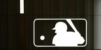 MLB logo with a baseball player silhouette