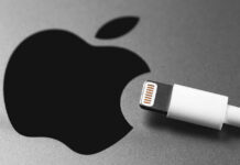 Apple logo next to white Lightning cable.