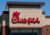HORRIFYING Attack at Chick-fil-A — Mass Shooting Chick-fil-A restaurant sign on a brick building